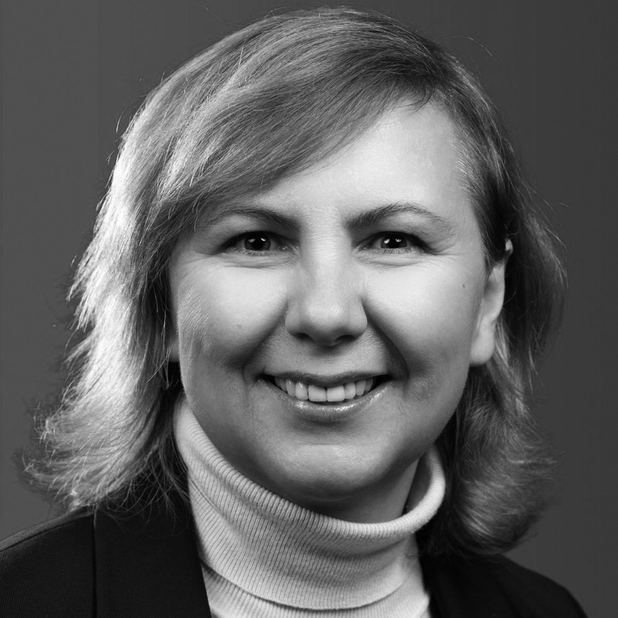 black-and-white portrait photograph of a smiling woman